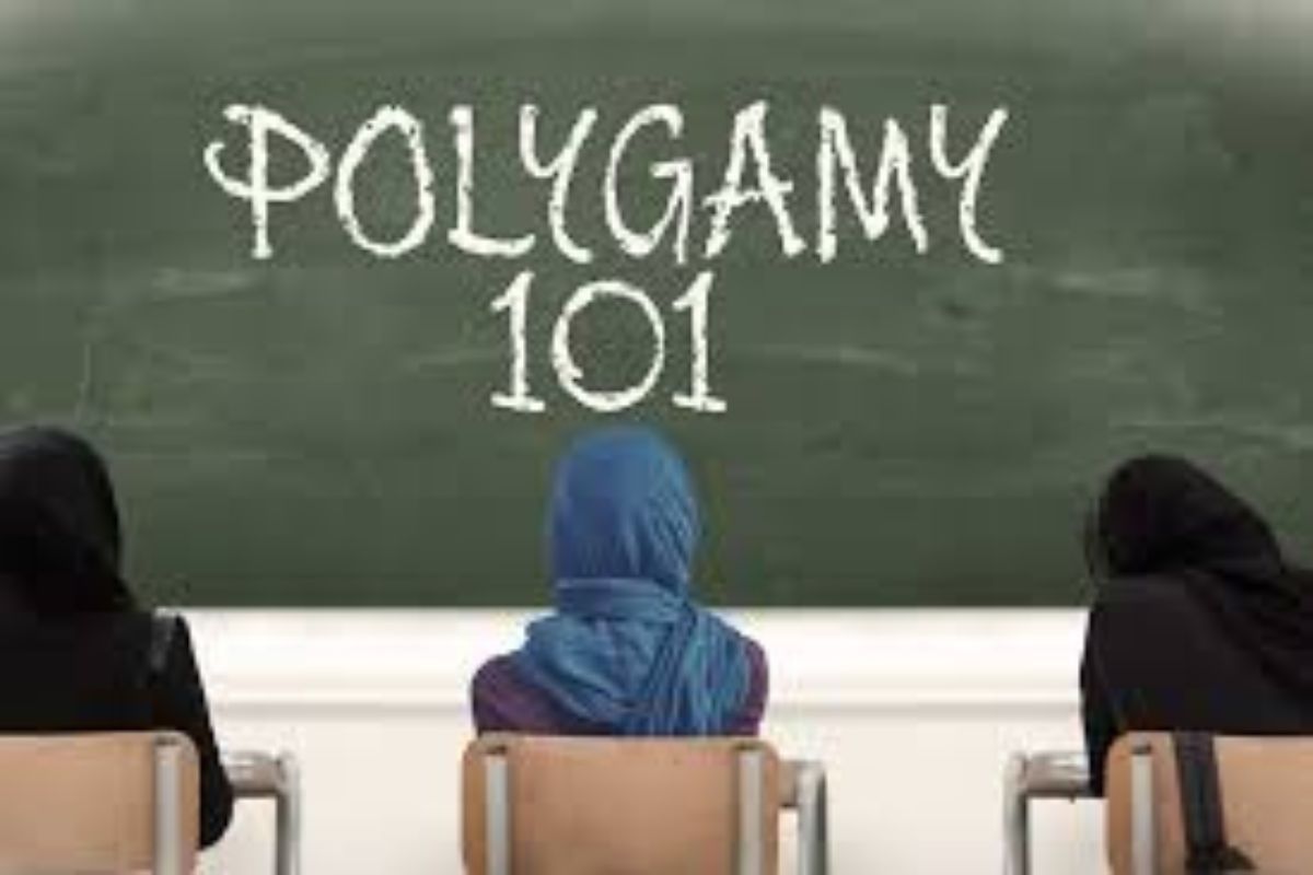 A chalkboard with the word Polygamy 101 written across it and 3 women sitting in front of it